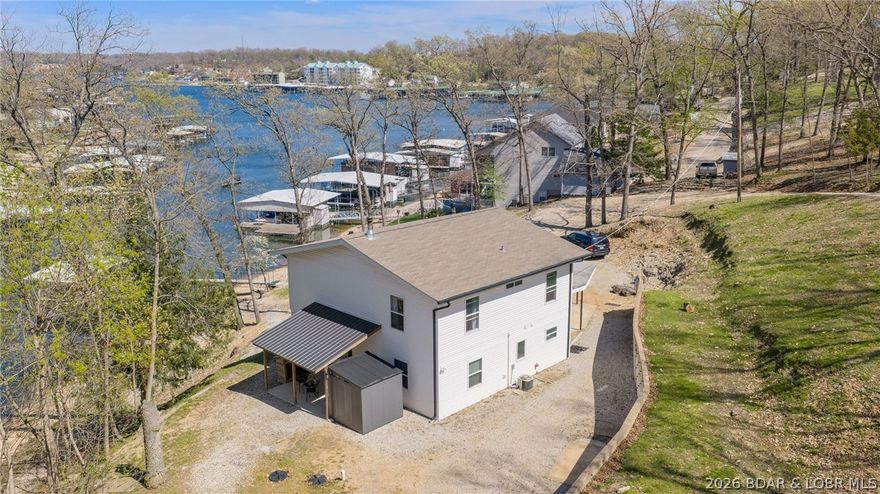 Rare opportunity for privacy on the water with 457 ft of lakefront and 2.7 acres in Lake Ozark on the 1.5 MM! Tucked just off Duck Head near Horseshoe Bend Pkwy, you’re less than 10 minutes to the Bagnell Dam Strip by road, with an unbeatable location by both land and water.

This 3 bed, 2 bath home offers charm and is move-in ready, with stunning lake views from both levels. The kitchen and dining area truly shine, surrounded by water views.

The cove features a lakefront café and gas dock for added convenience, and you’ll enjoy year-round water with a beach-like shoreline and even a rope swing.

No HOA, private well and septic, plus plenty of room to expand—build a guest house, second home, or add more dock space.

With abundant wildlife, space to explore, and endless possibilities, this property is perfect for making your lake life dreams a reality—all at an incredible value.