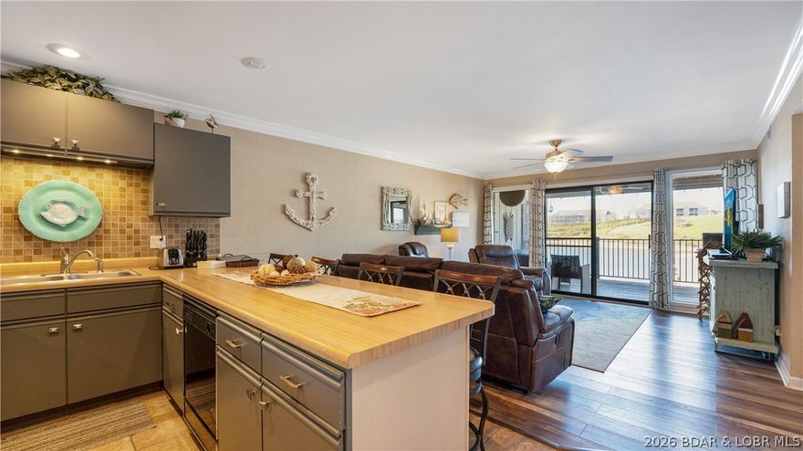 Enjoy lakefront living with zero hassle in this turnkey 2 bedroom, 2 bathroom Southwood Shores condo. Located in Four Seasons on the 12 mile marker, this unit offers a nice lake view and includes a 10x24 boat slip, making it easy to get out and enjoy the water. Conveniently located by land near Lazy Gators, Shady Gators, The Office, and the Bagnell Dam Strip, and just a short boat ride to Lake House 13. The condo comes fully furnished with nearly everything included, allowing for immediate use or rental. Recent updates include a new HVAC system installed in 2025. Southwood Shores amenities feature gated entry/exit, an indoor pool, outdoor pool, tennis courts, playground, boat ramp, and boat trailer parking. With nightly rentals allowed, this property is perfect as a personal lake getaway or income-producing investment.