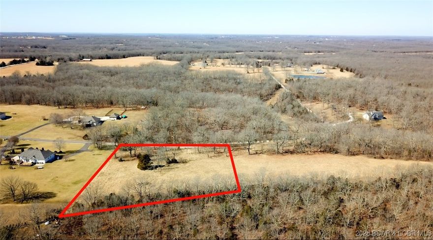 If you are looking for an incredible spot to build your dream home, in a subdivision of lavish lawns, you had better check this one out.  Is a nice yard, garden spot, or chickens something that is of interest to you?  What about an easy in and out for your RV where you can build a separate RV Garage/Man Cave?  The drive in to this stunning 3 acre parcel passes through a subdivision of homes that all are seated on 3+ acre lots, with a blacktop road to this property.  Privacy in a location that sits between Camdenton and Osage Beach with an easy backdoor to highway 7 that takes you to Lebanon or shoots you to I-44 toward Fort Leonard Wood.  These lots are hard to find at the lake!  Already cleared and open it is an easy lot to view and see all of the potential waiting  there for you.