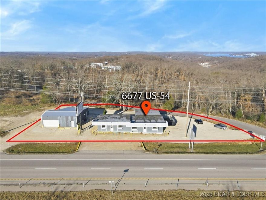 Rare opportunity to acquire a fully occupied mixed-use commercial property offering immediate cash flow. Ideally located on Hwy 54, with an estimated 20,000 vehicles per day, this property offers exceptional visibility, just minutes from Osage Beach and Camdenton. The property features a diversified income stream, including a workshop, retail space, residential apartment, and existing billboard rental income. All spaces are currently occupied, creating stable revenue while minimizing vacancy risk. The combination of commercial and residential uses makes this an attractive investment with built-in flexibility. In addition to the current income, the property offers significant upside potential. There is room to expand the existing structures and the option to add a digital billboard, presenting a compelling opportunity to substantially increase revenue and maximize returns. With strong location fundamentals, highway frontage, multiple income sources, and future development potential, this is a rare find in a high-demand corridor. Whether you’re seeking a stable long-term hold or a value-add opportunity, this property delivers immediate cash flow with long-term growth potential.