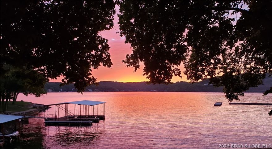 Lakefront living in the heart of Osage Beach! This top floor 1 bedroom, 1 bath condo at Weston Point Resort Condos comes fully furnished, with a 10x24 boat slip and 6,500lb Econo boat lift with remote located right in front of your unit. You'll love the sweeping main channel views from your expansive wrap-around private deck that offers a roll-out sunshade for additional comfort. BONUS-the HVAC was replaced in 2021! This complex has a wonderful park-like setting, with easy walkable access to the pool and docks. This lakefront unit offers wonderful views of the lakefront pool as well. Take advantage of a prime location, being just minutes from shopping, dining, and entertainment. Enjoy the lakeside community pool, as well as other amenities including a tennis court, laundry facilities, boat ramp and boat trailer parking. This unit allows for affordable lake living, with the ability of being a fantastic rental. Whether you are wanting an income-producing investment property, or to enjoy this unit all to yourself, the option is yours!  Call for your private tour today!