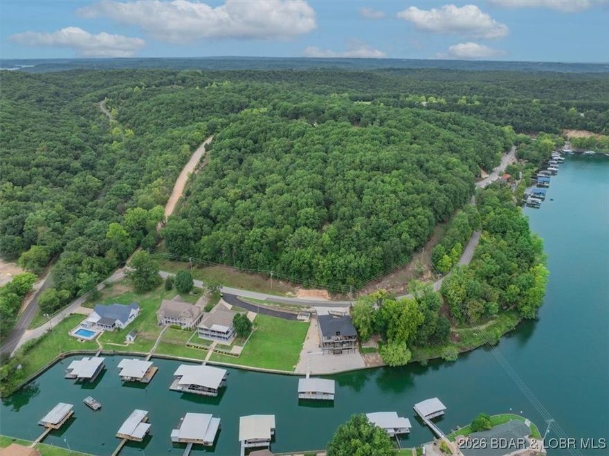 Here is an outstanding Offering of Land Tracts and a large Lakefront Lot with 2nd and 3rd Tier Acreage with Water Views. The "4th Tier" Tract of 5.4 Acres, more or less, does not face the Lake, just the 2nd and 3rd Tiers face the Cove with Main Chanel views.  All Parcels are ready for Development in one of the most desired Coves at the Lake of the Ozarks - Laurie Hollow Cove.  Mistwood Airport (24MO) is just up the hill from this approximate 19.83 Acres, more or less. The opportunity to Develop this once in a Lifetime area of ground is now available for purchase with endless possibilities. The POA (Property Owner Association) has already set up Mistwood Moorings POA. There is approximately 500 feet of Lakefront with approximately 300 feet of Concrete and Rip Rap Seawall already established.  The 6.5 Acres, more or less, of 2nd Tier and a 3rd Tier at approximately 6.7 Acres, more or less, have elevated Views of the Cove and Main Channel. You do not want to miss this opportunity to start this Land Development Offering with Blacktop on side of the perimeter Acreage. Close to all of the happenings on both sides of the Lake at the 35 MM. Let your Investment Adventure begin!