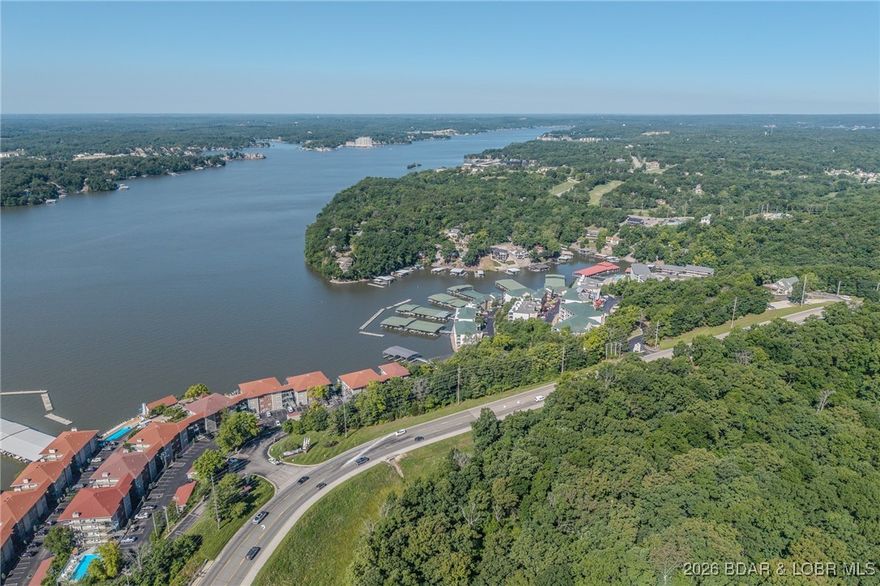 Rare opportunity to own 3.10 acres of prime land in the heart of Lake Ozark! This exceptional property offers panoramic lake views and is ideally located just moments from the Bagnell Dam Strip, Woods Supermarket, and all the action Horseshoe Bend Parkway has to offer. With ample road frontage and a gently rolling wooded landscape, this lot is perfect for a private estate, luxury lake-view homesite, or potential development. This is your chance to build where lifestyle and location meet! Schedule a showing with us today!