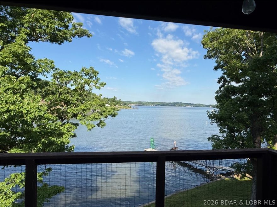 WOW! WOW! will be your thoughts when you see the awesome view from this unit whether from in the unit or out on the oversized deck.  The view is soooo good you will always take a last look when you have to go home after a wonderful stay at the lake.  Just a few steps from the lake and a swim/fishing dock in front of the unit.  This two bedroom, two bathroom condo is a top floor unit so no footsteps above you!!  The unit is Turn Key and ready for you to stay in.  Lone Oak Point is a tree shaded peninsula and features a clubhouse, outdoor and indoor pool, game room, play ground, volleyball.  Included is a boat slip.