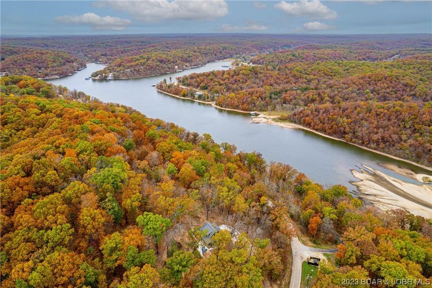 PRICE ADJUSTMENT! Stunning Views! Private subdivision! Don't miss this opportunity to build your dream home located in the new EAGLE BAY SUBDIVISION located at LAKE OF THE OZARKS on the 55 MM! This lot is offering 4.94 Acres! The views are lavish and picturesque! Nestled at the top of the hill and surrounded by thick woods, matured trees, walking trails, water view! Plenty of deer and turkey for you avid hunters! Fishing, swimming, boating-access to covered dock! Hurry this one won't last!
Several lots for sale-including more acreage or purchase the entire 17+ acres with new construction just completed!