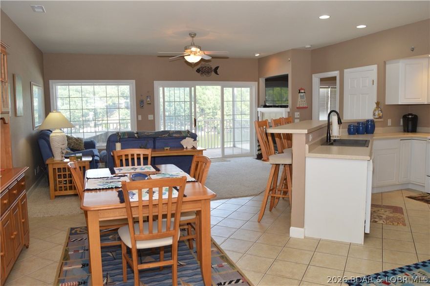 Enjoy the panoramic views from the point pool of the 1 mile marker while being protected in the Eastern facing cove setting! The luxury of a Lighthouse Pointe condo with gated entry, elevator access to pool and docks and the added convenience of being within 10 minutes of shopping, restaurants and medical facilities will not disappoint. Features include 3 beds/2 baths, open floor plan, 14x40 boat slip (seller has 2' of the slip filled in but can easily be removed) & PWC slip. It is easy to entertain guests inside the open floor plan unit with large screened deck or at the spectacular point pool with hot tub. The primary suite is spacious with access to the deck, views of the quiet cove and connected to the spa like bathroom with a dual sink vanity, walk in shower, jetted tub, & walk in closet. The condo offers 2 additional bedrooms and a convenient hallway/guest bathroom. A storage room right off the entrance is even useable for barbeque grill or additional lake toys. Come check out this awesome condo package at premier Lighthouse Pointe!