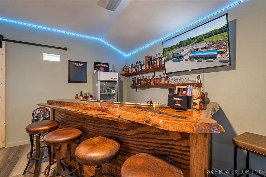 STOP THE PRESSES! Here is your opportunity to own a your own bar and grill in Camdenton, great location in an under served market! The bar/restaurant/lounge has details such as indoor and outdoor seating areas, a deck and pool, plenty of parking, a professional ventilation system, and high fence for security. So much to love with a walk-in Spanish Cedar humidor, ornate decorative bar, plenty of seating, a party room, and a functional kitchen. The outdoor area is perfect for live music, corn hole, and volleyball and has ample spots to relax and relish in good conversation, a flavorful cigar, with a refreshing drink in hand! Schedule a showing today. Business will remain open and fully operational until sold!