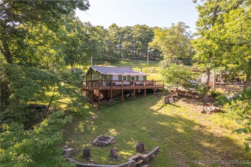 Welcome to Turtle Cove! Private lakefront oasis with 2 homes on 1 acre and 20ft of lake frontage! Featuring a completely remodeled 2 Bedroom FULLY FURNISHED vintage log cabin with modern lake vibes including a wood burning fireplace and hot tub for year round enjoyment! Massive wrap around deck to relax on and soak up main channel views. Includes fixer upper 1 Bedroom 450sf manufactured home with all utilities in place as well. Second tier lot and local leased slip added to listing.