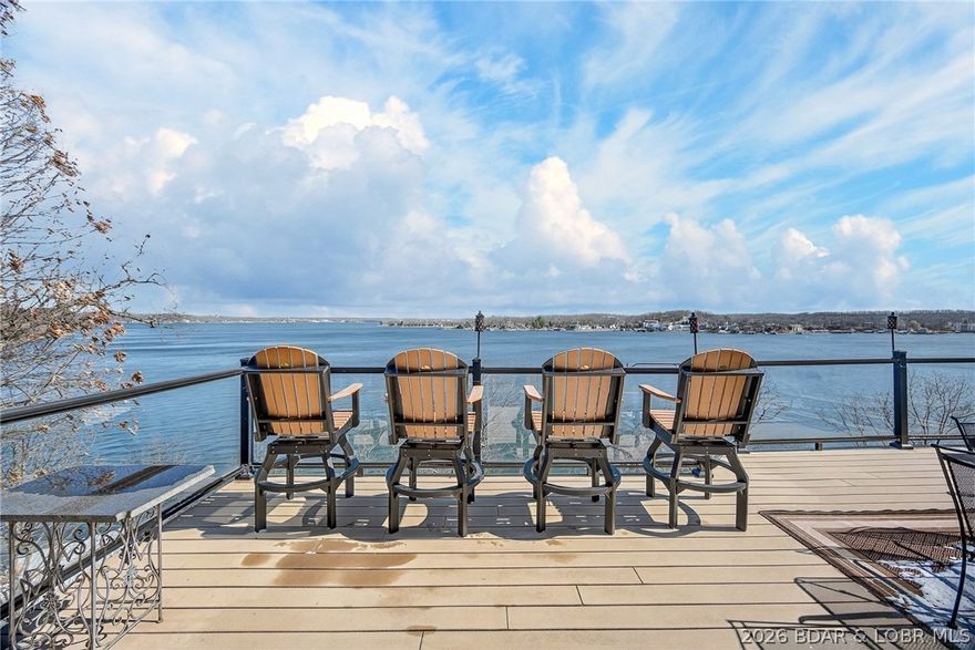 This one has it all! First is the VIEW...9 mile marker of Lake of the Ozarks!  4 spacious bedrooms with 5 bathrooms.  Walk in on the main level game room and enjoy hanging out with the gang inside or out. This floor includes 2 master suites on either end and a huge covered deck.  A few steps up to the middle level and you find the open kitchen/living room/bar area in addition to 2 more large bedrooms with extra sleep space and 2 more bathrooms.  And the Deck is the perfect place to watch boats or sunbathe.  But wait there's more...The top floor is a space all it's own with more of the fabulous views, family room, extra sleeping area and full bath.  Don't forget the firepit out front perfect for telling stories or having an evening cocktail.  VRBO income already booked with $30,000 and that's just early rentals.  Sleeps 22 and has overflow.  Approximately 1.06 acres +/-. Need a shop to keep all your toys? Check out mls#3584777 $299,950  This one truly is a one of a kind custom built home!