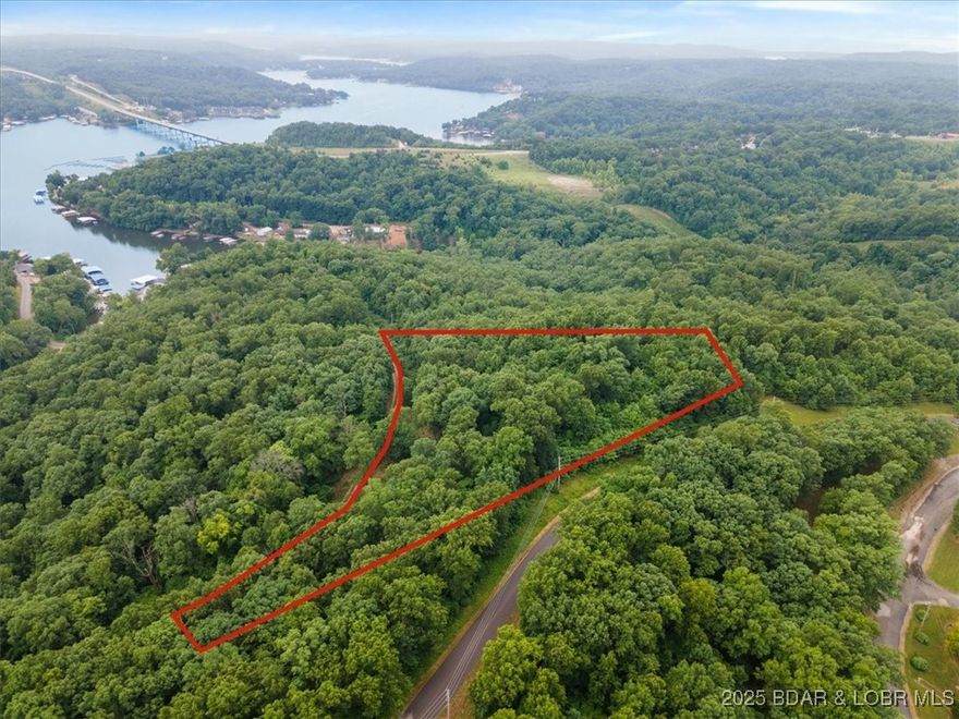 Ready to make the jump in buying land at the Lake of the Ozarks with a view?! This lot is conveniently located by many lake attractions and restaurants that you’ll be sure to enjoy. There are utilities in place with an old well and septic on the property. With zero restrictions and water access close by, you have the freedom to build the dream home you’ve always imagined. You can use the existing gravel road for access or put in a private driveway off the pavaement. For more information on this property, give us a call today!