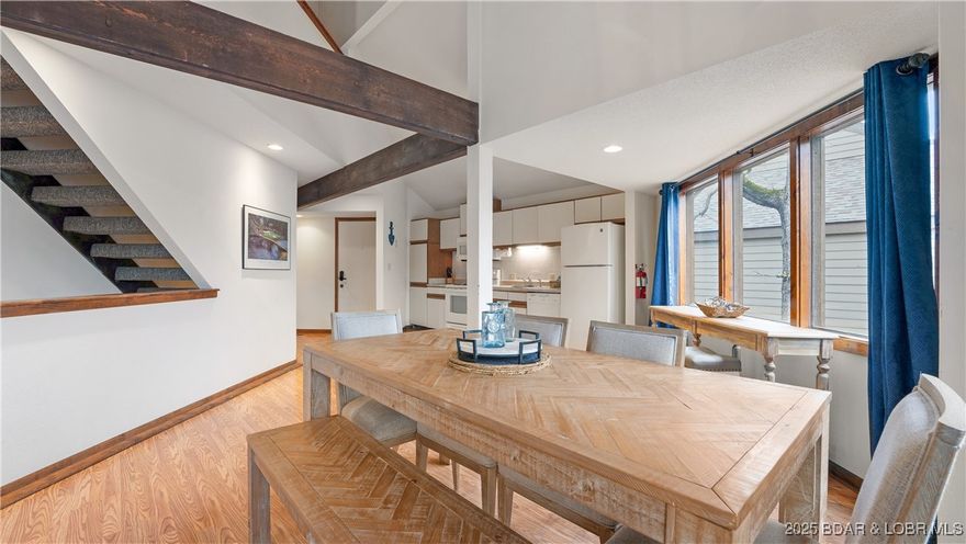 Beautiful maintenance-free living in this 1524 sq. ft. home with master bedroom on main floor, open concept living, and all amenities included. Enjoy the swim dock, splash zone, community pool, and fire pit in this family-friendly lakeside community. Perfect for entertaining and year-round living. Includes everything for easy, comfortable living in a peaceful lakeside setting!