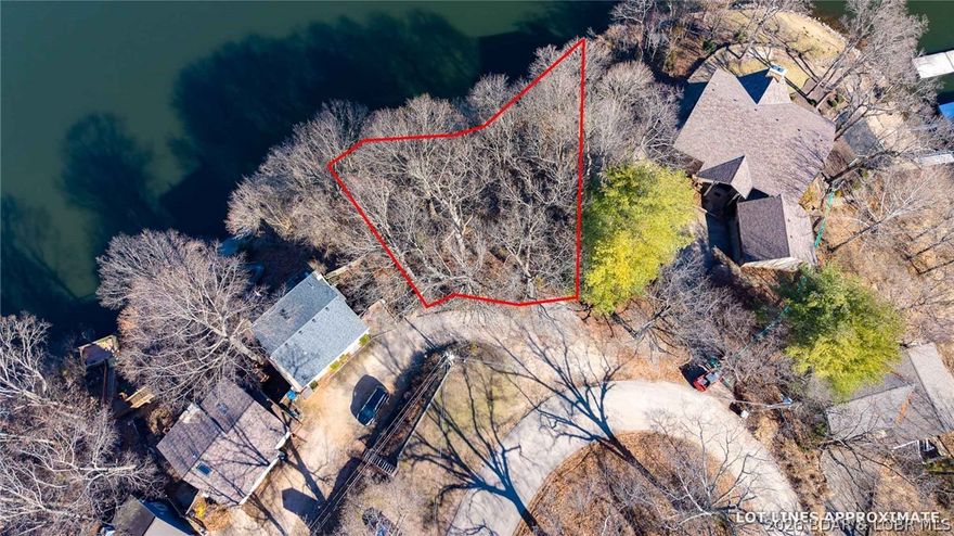 If you’ve been waiting for the right lakefront lot — this is it! With 150 feet of shoreline and jaw-dropping main channel views at the 29 Mile Marker, this property delivers the kind of backdrop people move to the Lake for. Big water. Big sunsets. Big “wow” factor. Perfectly positioned in the heart of everything the Lake of the Ozarks has to offer, you’re in a prime location by land and by water — close to popular waterfront restaurants, entertainment, and marinas, yet set up to build a private retreat that feels like your own slice of paradise. The topography is ideal for a multi-level design that maximizes those sweeping views - envision a modern showpiece with walls of glass and expansive decks. Bring your builder. Bring your vision. And start building the lakefront home you’ve always promised yourself.