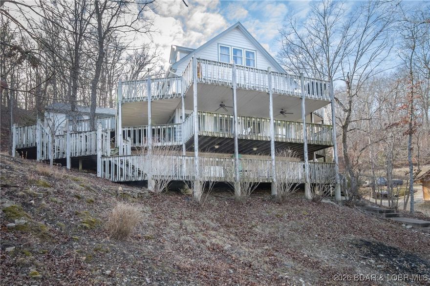 **BIG PRICE REDUCTION** 60K Lower **Lakefront on "3" Acres **   **30' X 40' Building with 2 bays** One owner Custom Built Home - 4/3 Lakefront home sits on 80' of Lakefront in a large wide deep water cove. Includes over 3 acres with a **HUGE 30' X 40' SHOP** shop includes heat & extra tall doors for RV parking/storage. Main level living home with a Newly remodeled kitchen, includes custom cabinets, Living room, primary bedroom, and full bath! Home includes multiple levels of living space. Lower level walkout includes rec room, bar, bedroom and bath. Top floor has 2 bedrooms & a full bathroom! Detached 2 car garage! Lot's of deck space for outside entertaining and to enjoy the lake. Nice private dock! Cove setting with a lot of privacy.