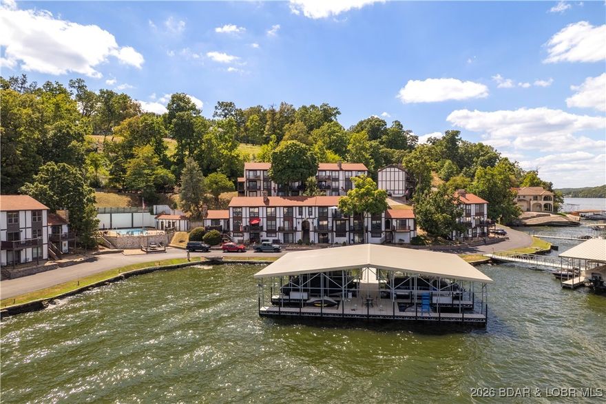 This beautifully renovated 2 -level, 2-bedroom, 2-bath condo offers modern comfort, thoughtful upgrades, and premium finishes throughout. Move-in ready, it’s ideal for full-time living or a lakeside getaway. Included is a12x32 boat slip in the new rough water dock for easy lake access. Inside, the unit was gutted and rebuilt with new drywall, and double-hung insulated windows with e-glass fill the space with light while improving efficiency. Major systems were replaced, including electrical panel and wiring, furnace and heat pump w/Ecobee thermostat, hot water heater, and large-capacity washer and dryer. The remodeled kitchen features custom soft-close cabinetry, new countertops, farmhouse sink, Bosch dishwasher, oven, built-in microwave, and refrigerator. A custom dining table adds a handcrafted touch. Both bathrooms were fully remodeled, and new LVP flooring offers durability and a sleek, modern look. The condo is fully furnished with all new pieces. Entertainment is easy with mounted flat-screen TVs in the living room and bedrooms, plus motorized window shades for effortless light control and privacy. Make this turnkey retreat yours and schedule a showing today!