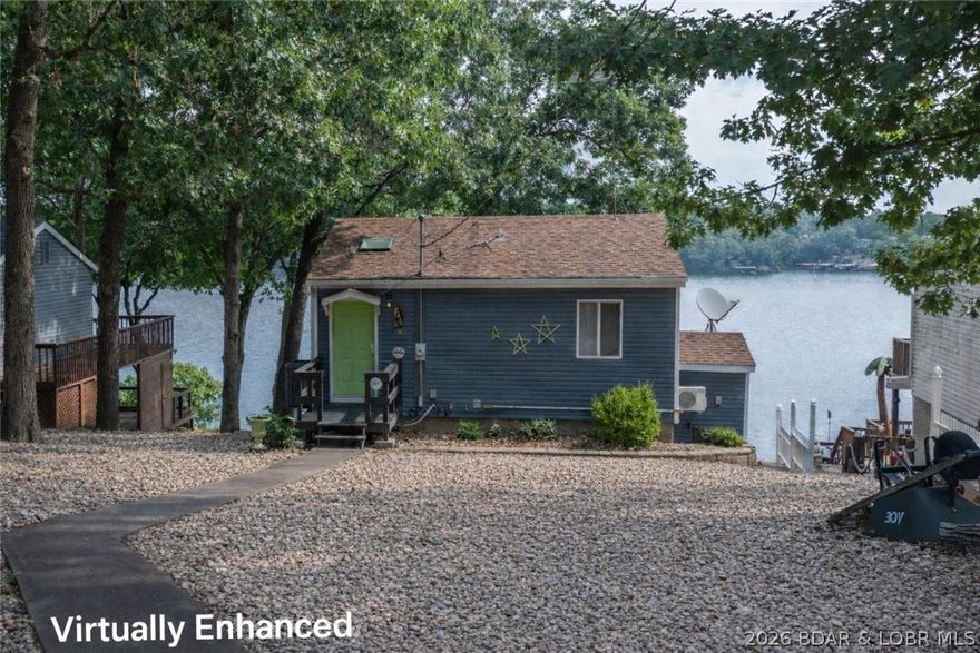 VIEW, VIEW and MORE VIEW! With 180 degree panoramic views from this elevated location, you can literally see for miles! The open layout and abundant lakeside windows create volume and light throughout the home, and there is ample seating in the large dining space and dining counter in the kitchen. The deck off the living room adds tremendously to outdoor living and dining as it has been recently doubled in size, but both levels offer very spacious decks where you can relax and take in the incredible ambiance of the Lake of the Ozarks! The front yard of this property is expansive and very gentle, so you can easily add a garage, guest house or storage if desired. You will especially enjoy that the property is so close to all the amenities available in Camdenton and Sunrise Beach, and there is blacktop all the way to the home. With plentiful FLAT parking, and newer large decks, you will want to host all your friends and family. The cherry on top is the new tram that has been added allowing this home to enjoy the magnificent views while alleviating any burden of travelling to the dock for your day out on the water. You have to see it in person to fully appreciate-Schedule now!