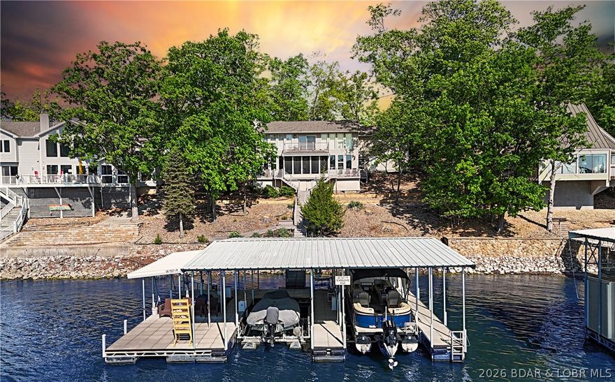 This 3-bedroom, 2-bath home on Nonsuch in Lake Ozark is now available for the first time in many years. The unique upper level is a dedicated primary suite featuring a living area with a stone gas fireplace, a private kitchen, a walk-in closet, a beautiful, updated bath, and a bonus room or office with a built-in Murphy bed and garage access. The main level includes a second gas fireplace, two bedrooms, a bathroom, and a fully updated custom kitchen with granite counters and a walk-in pantry and LVP flooring. Let's head to the dock through the screened porch an out to the no-maintenance decking.  At the dock you'll find the covered double PWC lift, two 12 x 28 slips, a storage shed, a fish cleaning station, and a swim platform with wet steps. Enjoy the great view of the main channel and some cove protection.  Not in Four Seasons so very rentable.  Make some money while you enjoy this home with friends and family.  I think you'll want to spend your lake days here or just move here full time.  Nonsuch is a cul-de-sac so not much traffic here.  See it soon!!!