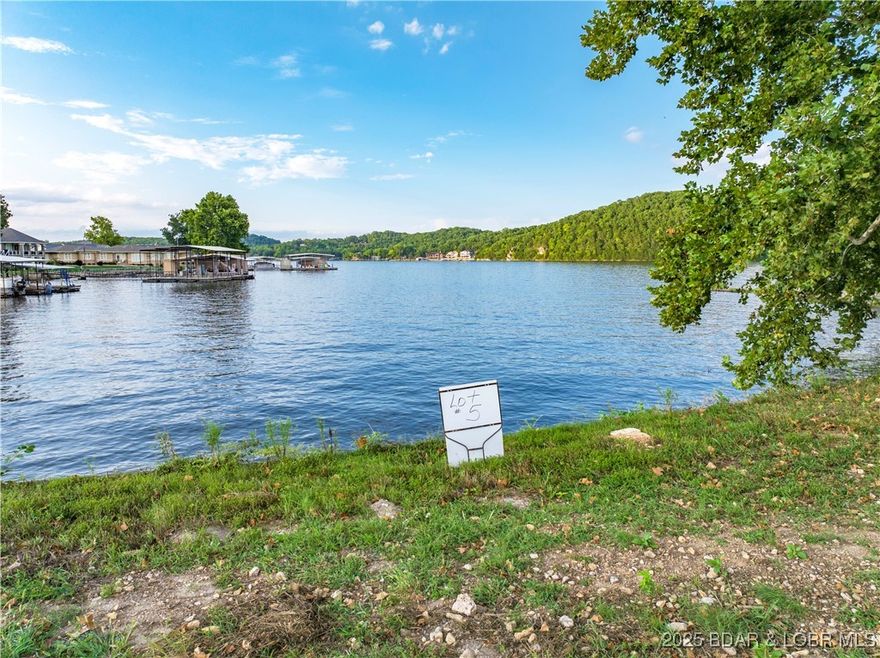 Back on the Market!!! Welcome to Camden Estates, an exclusive new development on a picturesque point at the 44MM of Lake of the Ozarks. Presenting Lot 5—an exceptional opportunity to own a prime piece of lakefront. This lot features approximately 153ft of pristine lakefront and spans about 1/2 of an acre. The land has been improved to elevate from the floodplain and a seawall is already in place. The community will feature on-site sewer treatment and community water services. While connection fees for utilities are still to be determined, this lot offers an incredible foundation for your dream home, with a minimum build requirement of 3,000+ square feet. What sets Kamden Estate apart is its remarkably flat terrain, allowing you to build just steps from the water’s edge—perfect for those who want to live the ultimate lakeside lifestyle. Enjoy calmer waters ideal for swimming and boating, while still being close to popular local spots like Boondocks and Bear Bottoms. Don’t miss your chance to be part of this exclusive community. Lot 5 at Kamden Estates is where your vision of luxurious lakeside living becomes reality.