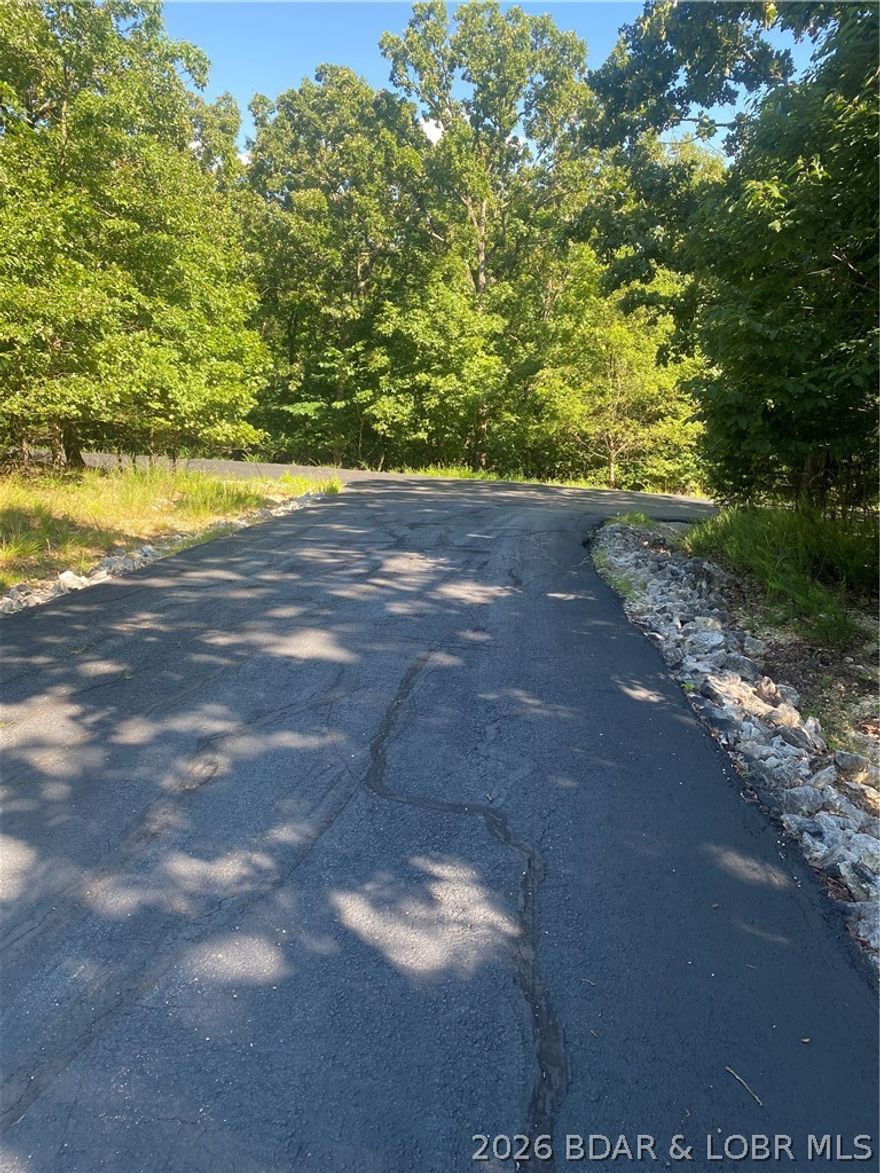 Lot 1275 in the sought-after Champions Run Subdivision offers a gentle, buildable setting. This residential lot gives you access to world-class amenities such as a private golf course, yacht club, marina, clubhouse, pool, and more. Located just minutes from the Community Bridge and many Lake of the Ozarks hotspots, makes this a great place to call home. Make the trip to discover and see for yourself what this lot has to offer with the ideal blend of quiet living and convenience. Whether you are building now or later, this is a prime opportunity to stake your claim in one of the lake's most coveted neighborhoods.