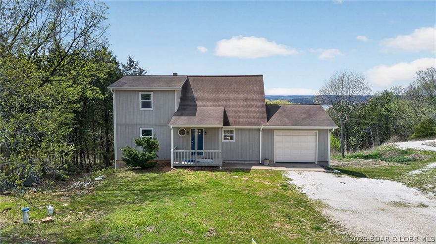 Enjoy lake living at its finest in this 1.5-story home overlooking the gorgeous waters of Truman Lake. This 2 bedroom, 2.5 bath property sits on just under an acre, offering the perfect blend of space, comfort, and convenience. Inside, you’ll find a functional layout with plenty of room to relax after long days at the lake. Outside, take in the view from your own piece of paradise. An attached garage and carport provide excellent parking and storage for vehicles, boats, and lake toys. If you’re dreaming of a Truman Lake getaway with unbeatable views and room to make it your own, this one checks all the boxes!