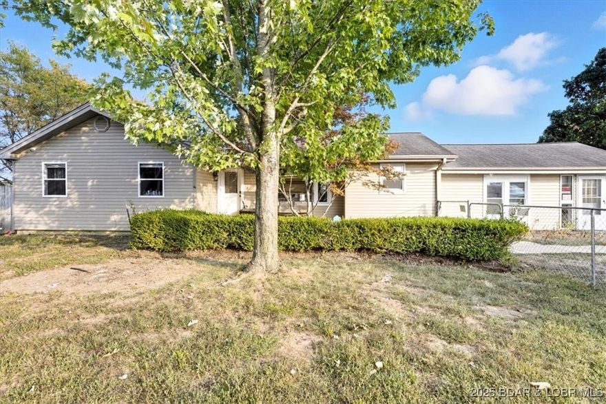 Motivated Seller!!! Welcome to this inviting 5-bedroom, 3-bath home nestled in the heart of Osage Beach. Situated on a large, fully fenced lot, this property offers plenty of space for outdoor living, pets, and play. Two oversized shops provide endless possibilities — whether you need room for hobbies, storage, or a dedicated workspace. Conveniently located just minutes from local shops, restaurants, and entertainment, this home blends comfort, functionality, and prime location. Don't miss your chance to own a property with so much to offer in one of the area's most desirable spots!