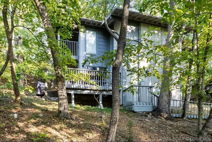 Welcome home to this beautiful 3 bedroom, 3 bathroom retreat on a wooded lot in sought-after Tan Tar A Estates. Adjacent to one of the lake's most popular resorts, this home is perfect for year-round living, short or mid term rental, or a lake getaway! The home is currently set up as one large single residence, but it can also be easily split into three separate units. Live on the main floor and host a bed and breakfast, or rent all three separately. So many options! The home is fully furnished and tastefully decorated throughout. Enjoy your morning coffee on the deck with a seasonal lake view or take the nearby path down to the water. There are several pools throughout Tan Tar A, as well as access to the resort by car, golf cart, or a short walk.