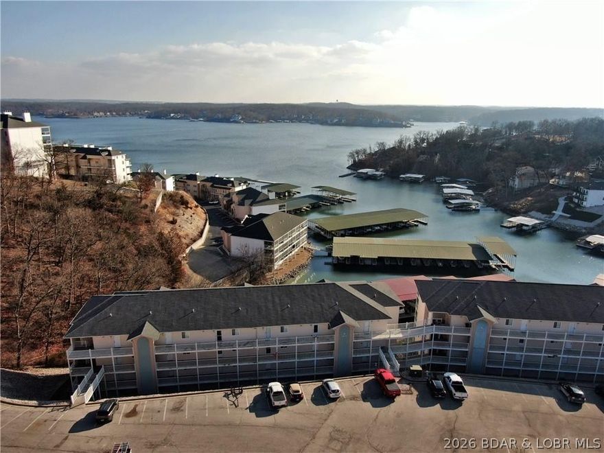 Pleased to present this beautiful, fully furnished 2-bedroom, 2-bathroom condo located in Lake Ozark. Situated in a quiet cove at the 14mm and conveniently located off HH, this property serves as an ideal personal getaway or a high-potential vacation rental. The condo features a covered patio with excellent lake views and is just a short walk from the community pools, dock, and boat slips. Additionally, you will be a quick drive or boat ride away from local amenities, including restaurants, golf courses, grocery stores, and the Bagnell Dam Strip. With low HOA assessments, this is an affordable opportunity for anyone seeking a permanent residence or an investment property.