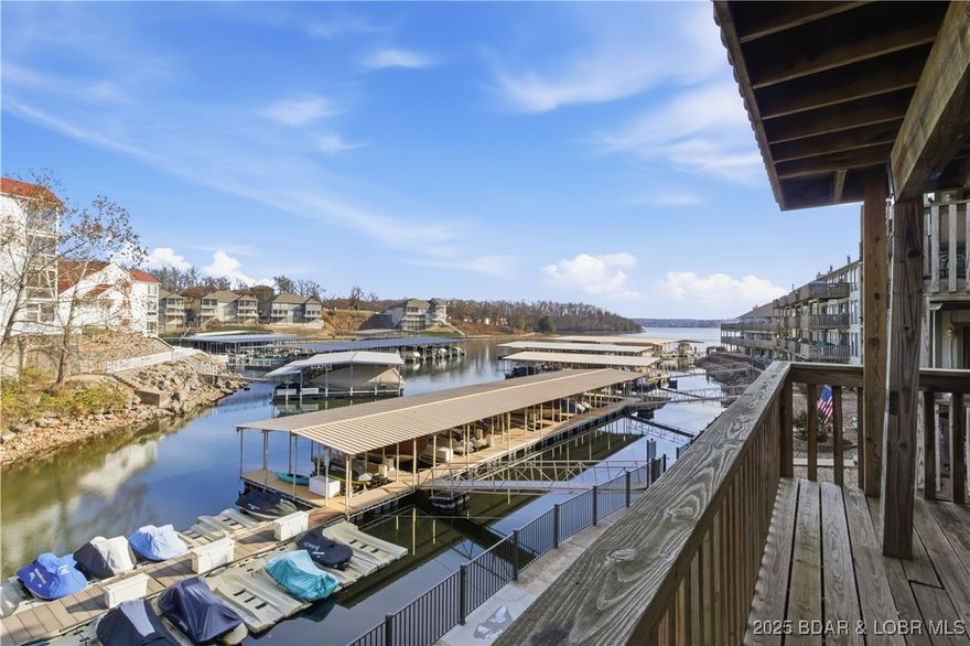 Experience the ultimate Lake of the Ozarks escape in this highly desirable and income-producing waterfront condo community! This beautifully maintained 2-bedroom, 2-bath end unit offers 869 sq ft of stylish comfort and includes one of the largest boat slips in the complex (14x32)—a rare and valuable feature. Updated in 2021, the condo showcases new interior paint, modern bathroom vanities, and updated lighting, creating a bright and contemporary ambiance throughout. Relax and unwind with serene main-channel views, all while enjoying the peace and protection of a quiet cove at mile marker 12. A newer air conditioner (2019) ensures year-round comfort. Residents and guests love the resort-style amenities, including indoor and outdoor pools, a clubhouse, boat ramp, seawall, playground, tennis court, and more—everything you need for effortless lakeside living. Whether you're seeking a prime investment opportunity or the perfect personal lake retreat, this standout condo checks every box. Don’t miss your chance to own a piece of the Lake lifestyle!