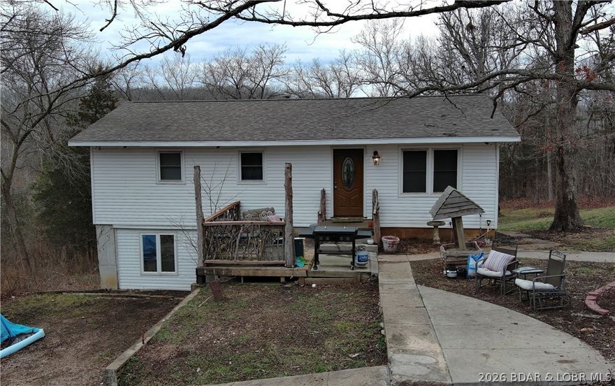 Enjoy the perfect blend of country living and convenience in this charming 4 bedroom, 2 bath home located just minutes from Eldon. Step inside to original hardwood floors and a spacious open-concept layout designed for comfortable living and entertaining. The kitchen features a large island, tons of cabinet space, and flows seamlessly into the dining area and inviting family room. The main level offers three nicely sized bedrooms and a full bath, providing a functional and welcoming floor plan. Downstairs, the partially finished walk-out lower level includes a fourth bedroom, second bathroom, and laundry area—plus plenty of unfinished space ready to customize to fit your needs, whether that’s a second living area, home gym, or additional storage. Enjoy peaceful surroundings with the convenience of being close to town. Don’t miss this opportunity—schedule your private tour today!