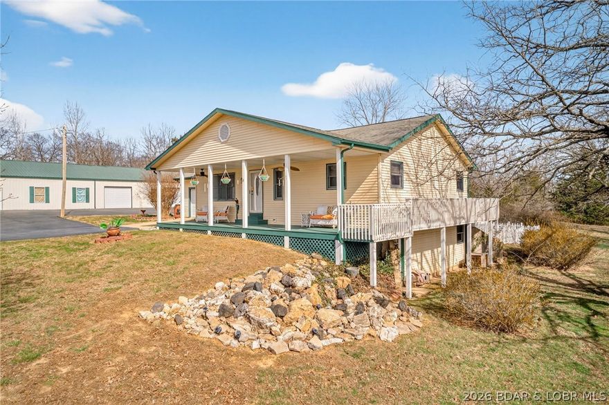 LIVE, WORK & PLAY!
This incredible property offers over 7,800 sq ft of shop space, easily accommodating 15+ vehicles, along with a dedicated workshop and RV storage bay—a dream setup for hobbyists, business owners, or collectors.
Perfectly situated on a sprawling 4+ acre lot, just 10 minutes from the heart of Osage Beach, this property delivers both privacy and convenience.
Relax and unwind with stunning sunset views from the covered front porch or entertain all summer long on the back deck featuring a pool and BBQ area—ideal for gatherings.
Inside, you’ll love the open floor plan with convenient main-level living. The bright and inviting four seasons room offers year-round enjoyment and direct access to the fenced backyard and pool deck.
The lower level adds even more living space, complete with a cozy wood-burning stove, an additional bedroom with walkout access, a full bath, and plenty of storage.