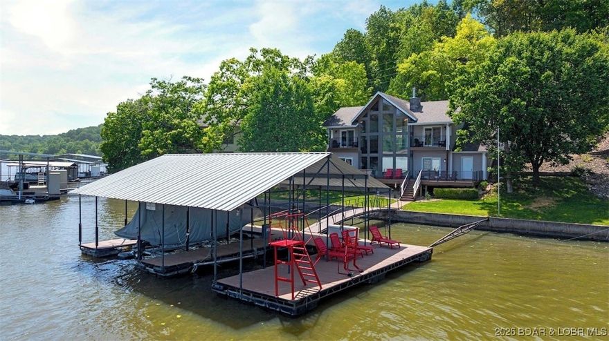 Incredible lakefront home on the 35 mile marker of Lake of the Ozarks! Located in a cove with main channel view, this place has tons of potential. Enjoy it as a full-time residence, personal getaway, or an investment property with nightly rentals! Gorgeous vaulted ceilings with tons of natural light facing due east. Two bedrooms and full bath are on the main level with a great family room space and the lower level features the kitchen with granite counters, stone fireplace, wood beams, ensuite with walk-in-closet, and more! Only a few steps to the lakeside, flat yard and year round water with over 20ft deep under the dock! Perfect for fishing and swimming. Just across the channel from Captain Ron’s, plus very close to The Cave, Bear Bottoms and numerous other places! High speed, fiber optic internet available, paved roads to the front door, parking for multiple vehicles, and only 2 hours to KC / 2.5 to STL.