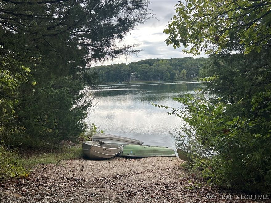 Build your dream home on this wooded cul-de-sac lot overlooking peaceful Treeline Lake in the Village of Four Seasons. This interior lake property offers a serene, wooded setting with water views plus access to all the incredible Four Seasons amenities — multiple outdoor pools, an indoor pool, clubhouse gym, tennis courts, and walking trails. Enjoy the Lake of the Ozarks lifestyle with the perfect blend of privacy, recreation, and community.