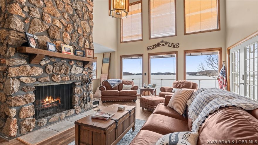 This is one of the most warm / welcoming homes you’ll find. It is offered Turn Key, so go right ahead…step inside to windows spanning the lake and start enjoying today. Glance up to the wood accent ceiling that creates that homespun charm. Invite the chef to prepare a feast in the fully equipped kitchen. The floor plan is designed to provide extreme privacy. When you’re ready to call it a day and the rest of the family is just getting started. You have the entire living area on the mid-level with a crackling wood fireplace and of course all the fixings in the kitchen for those midnight snacks for the night owls. There are 3 bdrms on upper level and a private primary suite on the lower level with a lakeside view, fireplace & access to the private deck all while the party continues upstairs. For those that prefer to park lakeside. You’ll find a boat dock suitable for a cruiser or fishing boat. By the way, with a private breakwater you get to enjoy the abundant lakefront with confidence of quieter water.  At the end of the day grab a favorite drink beneath the stars on the new composite deck beside the table top firepit. Come unwind after a day tossing a line off the dock or boat.