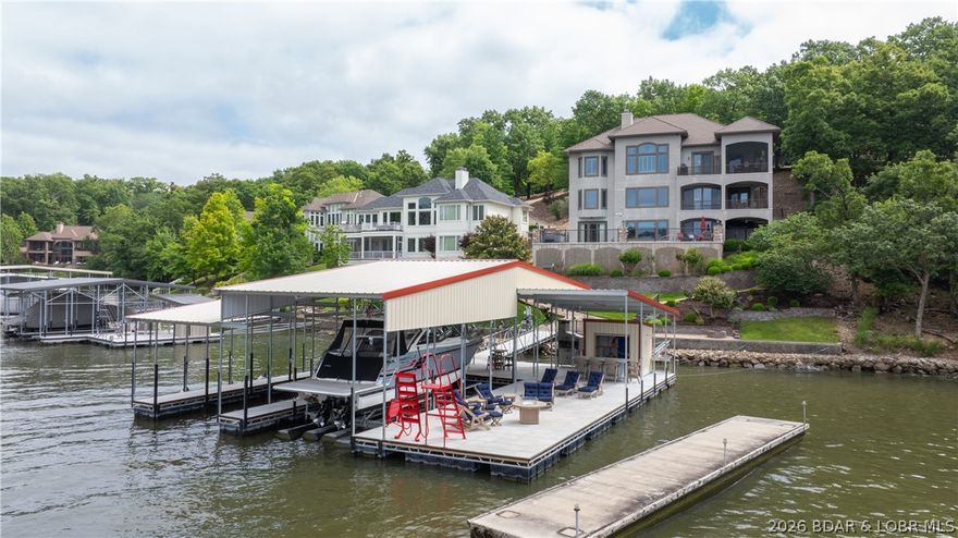 Experience the ultimate lakefront lifestyle in this breathtaking 6,000 sq ft luxury retreat! Fully furnished with newer, high-end furnishings, this exquisite home seamlessly blends comfort, elegance, and practicality. With 6 bedrooms and 5.5 bathrooms, there’s ample space for family & guests to relax in style. The main level offers an open-concept layout, featuring a custom gourmet kitchen, spacious living areas, & easy access to a screened-in patio—perfect for unwinding. The expansive master suite includes a luxurious en-suite bathroom and a generous walk-in closet. The lower level boasts 4 additional bedrooms, 3 full bathrooms, a second living area, and a wet bar—ideal for entertaining. A walk-out basement reveals a third living space, a 6th bedroom with private bath, and direct access to the private pool and hot tub. Enjoy stunning main channel views with the benefit of cove protection from your impressive 2-well dock, which includes a 16x44 slip, a 12x30 slip, 4 covered PWC slips, & a spacious swim platform. A 3-car garage completes this entertainer’s dream.  A complete package option is avail which includes the boat & cover, lift, PWC's, PWC Pads, for add. $$.