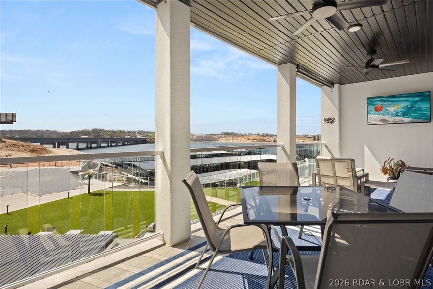 Experience the pinnacle of modern elegance at the brand-new Topsider Condos, perfectly situated at the 19MM in Osage Beach. This "sleek chic" 3-bedroom, 3-bathroom residence offers 1,600 sq. ft. of sophisticated living space, where 10-foot ceilings and an open-concept floor plan maximize natural light and breathtaking lake vistas. Every detail exudes luxury, from the premium quartz countertops and oversized kitchen island to the dedicated bar area with a beverage fridge, crown molding, and designer lighting. The primary suite serves as a private sanctuary, featuring a lavish walk-in shower and an extra-large vanity. Step onto your covered patio to enjoy sweeping views of the Lake, meticulously landscaped grounds, and a show-stopping infinity pool. Elite Amenities & Lifestyle: Resort Living-Clubhouse, fitness center, fire pits, and a dog park; Prime Location-Near Dog Days and the upcoming Oasis Amusement Park; Boater’s Dream-Includes a 12x32 boat slip; Flexibility-Nightly rentals are permitted; HOA covers cable, internet, and water. Ideally located just minutes from the Lake’s best dining and shopping—this is the stylish retreat you’ve been waiting for!