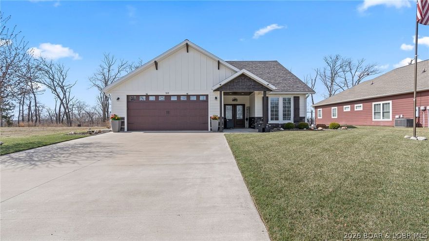 Lake Life Starts Here – Second Tier Home with 12x32 Boat Slip, year round lake view! Beautifully maintained home that includes a highly desirable community boat slip. With 1,696 square feet of living space, this tenderly cared-for 3bd/2bath home offers comfort, convenience, and easy access to the water located at the 31mm Linn Creek Cove- Four Corners. Spend your mornings enjoying coffee in a peaceful setting and your afternoons boating, or exploring waterfront restaurants, Fish, Cave, Papa Chubby, just minutes away from your dock., Walmart & Ha Ha Tonka State Park. The home features warm and inviting open living spaces, ideal for relaxing after a full day on the water or hosting family and friends for the weekend. A spacious two-car garage provides plenty of room for vehicles, and attic storage. Outside, the beautifully landscaped yard, equipped with irrigation system and outdoor fire pit.  Reflects the pride of ownership throughout the property and creates a welcoming setting for outdoor gatherings or quiet evenings. Located within a well-kept gated HOA community, this property offers the perfect balance of privacy, shopping convenience & lake access!