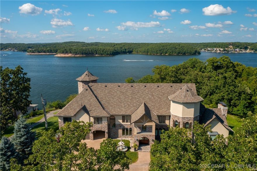 The Iconic Stone's Manson sitting on 2.5+/- Acres and 247 Feet of Lakefront, is available and ready for its next Owner. This property has been ENJOYED as a PRIVATE ESTATE and SHARED as a LUXURY Rental for Vacations and Events. This 9800 Sq.Ft. Home boasts 7 Bedrooms (5 en-suite), 6 Full Baths, 1 Half Bath, Two Full Kitchens, Multiple Entertaining Areas, a Theatre Room, Game Room, and this is just on the INSIDE. 3 Car Attached Garage (oversized), Detached Garage / Carriage House (to Store Golf Cart, Lawn Mowers, etc.), A Huge Back Yard, over 3500 Sq. Ft. of Covered Patio and Deck Space, Swimming Pool, Hot Tub, Grilling Area, and Firepit. FULLY TURN-KEY! All Furniture and Decor, Game Equipment, Appliances, Electronics and Outdoor Furniture. Great Location by Land and Water to all this Lake has to offer. Enjoy it as an Excellent Private Estate, or put it on the Rental Program for Luxury Vacation Rentals, Wedding, Retreats and MORE ... Great Rental History information is available.  This Estate has been impeccable kept and continuely updated to keep it in it's pristine condition.