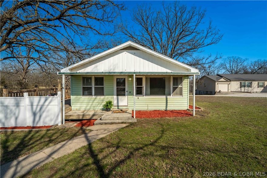 Charming, move-in ready, one level living perfectly located just outside Eldon city limits! This 3 bed, 1 bath home sits on a full, wood acre on a quiet dead-end road, offering both privacy and convenience—plus walking distance to Eldon South & Upper Elementary Schools. The beautifully restored hardwood floors and a long list of updates, including a new roof (2023), new central air (2023), new baseboards throughout and fresh paint that gives the entire home a clean, modern feel. The fully renovated bathroom features all-new plumbing, flooring, electrical, and vanity—done right from top to bottom. Low maintenance LVP flooring enhances rustic kitchen w/ new hardware & garbage disposal. Step outside to a deck just off the kitchen, complete with solar lighting, leading down to a spacious fenced yard. Whether you need space for pets, play, or entertaining, you’ll love the included dog kennel, room for a playground or fire pit area, and a detached garden shed for extra storage. Affordable, updated & full of charm—this property is a perfect fit for first-time homebuyers, downsizers or investors looking to add a solid asset to their portfolio.