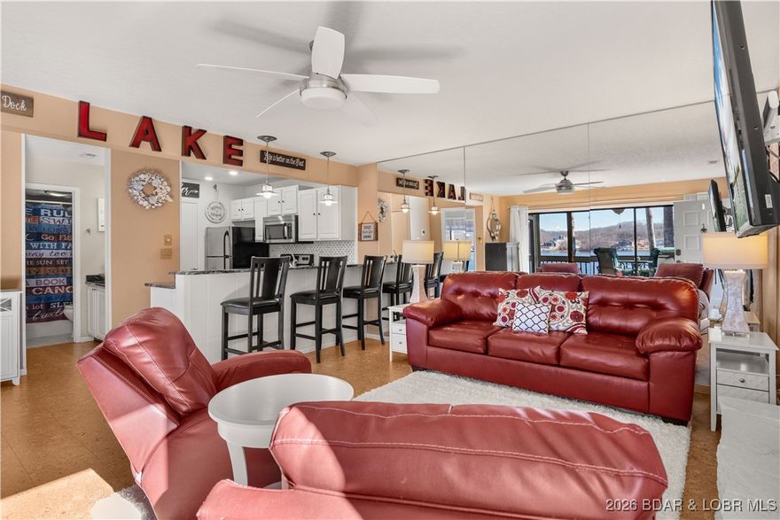 Experience the ultimate Lake of the Ozarks lifestyle with this incredible turn key opportunity at Bay Point Village. This fully furnished 1 bedroom, 1 bathroom condo is ready for immediate enjoyment or as a high potential vacation rental, as the complex permits short term stays. The interior features a spacious kitchen equipped with modern stainless steel appliances and plenty of room for entertaining. Your guests will be amazed by the Cork floors in the living room. What truly sets this unit apart is the massive value included in the price. Your purchase comes complete with 2 10 X 24 BOAT SLIPS, a 10,000 pound boat lift, and 2 PWC lifts. Rest assured that your boat and PWC's are safe as the docks are situated behind a protective breakwater, ensuring your investments are safe. Relax on your screened porch and take in the gorgeous lake views at the 25 mile marker of the Osage Arm. Whether you are looking for a weekend getaway or a savvy investment property, this condo delivers it all in one of the most sought after locations at the lake.