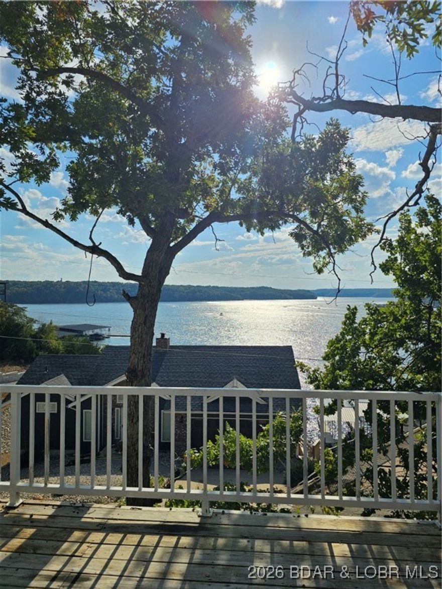 Experience some of the best of Lake of the Ozarks living in this charming 4-bedroom, 2-bath single-family home. Enjoy the ease of main-level living, complemented by a spacious lower-level living area with a walkout to a private patio—ideal for entertaining or relaxing. As a 2nd-tier lake home, you’ll enjoy views of the 1-mile marker of the Grand Glaize arm. This versatile property allows for vacation rentals, monthly leases, or full-time living, offering excellent flexibility and income potential. Additional highlights include ample multi-vehicle parking and a peaceful setting in the quiet Shorewood Estates neighborhood. Ideally located near shopping, dining, the business district, the Shootout Race Course, and the upcoming Oasis at Lakeport.
Motivated seller—don’t miss this opportunity.