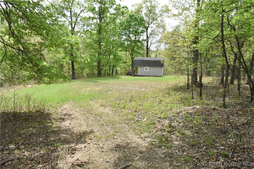 Rare opportunity to own 18.7 acres of beautiful, wooded land just minutes from the lake! This versatile property offers endless potential—whether you want to subdivide for multiple homesites or enjoy the peace and privacy of your own secluded retreat. Wildlife lovers will appreciate the frequent visits from deer and the serene natural setting. Located just a quick 2-minute golf cart ride to Papa Chubby's, one of the lake's favorite waterfront spots! Bonus: this property includes a 10x20 boat slip in the nearby community dock, so you can enjoy the best of lake life while surrounded by nature. Whether you're dreaming of a private getaway or a development opportunity, this land has it all!