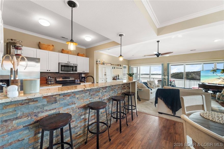 The Point at Palisades – premier lakefront retreat in one of the most sought-after gated communities at Lake of the Ozarks! This stunning penthouse 3-bed, 3-bath condo offers some of the best views the Lake has to offer. Vaulted ceilings, rich hardwood floors, and sleek granite countertops set the tone for elegance throughout. Be captivated by the panoramic 5-mile main channel view—visible the moment you enter. The spacious living room is the perfect place to unwind, complete with a cozy gas fireplace and access to your private deck. The lakefront master suite features a completely remodeled en-suite bathroom with a steam shower, jetted tub, and double vanities. Enjoy updated appliances, new light fixtures, new fans, and mostly new furnishings included.Guests will love the redesigned walk-in shower in the guest suite, and the kitchen is ready for entertaining with a new refrigerator, dishwasher and wine cooler. This condo includes a 12x32 boat slip. A terrific value and a rare find in an unbeatable location, only minutes from town. Available for lease @ $2500 per month