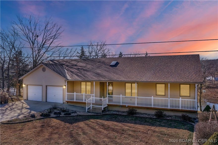 ?? Lakefront Living at Gatliff Lake in Warsaw, MO! This beautifully maintained property offers 280 feet of waterfront with a platform dock and boat lift. The main level features a welcoming covered porch, a bright open-concept living and dining area with lake views, and a spacious kitchen with custom cabinetry and stainless steel appliances. The primary suite includes a walk-in closet and an adjacent bath, with a second bedroom, full bathroom, and attached two-car garage completing the main level. Downstairs, enjoy a large family room, two additional bedrooms, and plenty of storage space. Outside, relax on the screened-in porch or by the fire pit, and take advantage of the extra detached garage and side yard. It's the perfect place to fish, watch wildlife, and enjoy the peaceful lakefront setting.