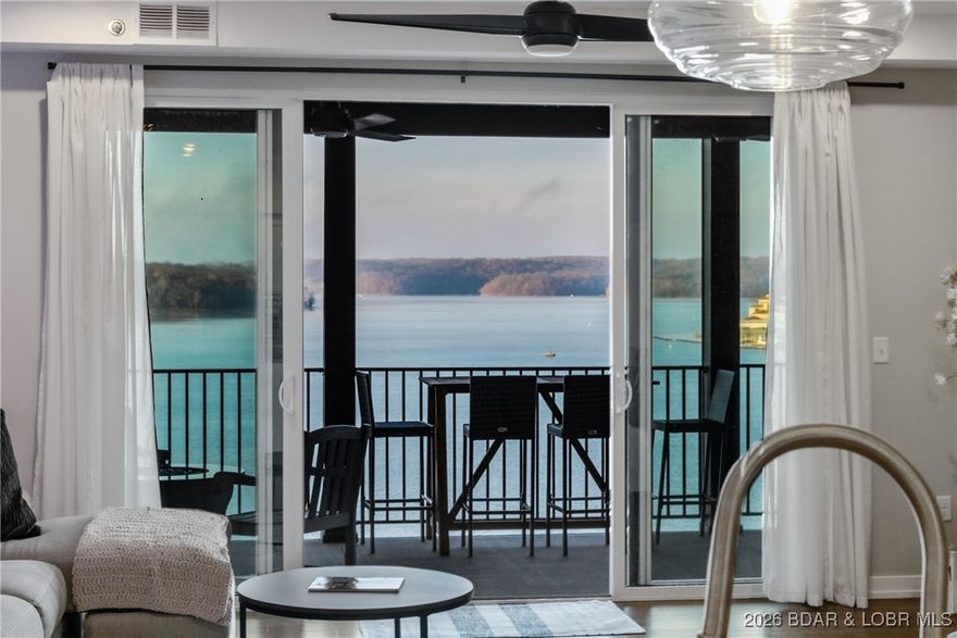 BIRDS EYE VIEW OF SHOOTOUT! Rare and spectacular TOP FLOOR 3-bedroom 2 bath - WITH ELEVATOR ACCESS JUST 5 STEPS FROM YOUR DOOR!  This is the ideal location at the 1MM of the Grand Glaize Arm and puts you in the middle of all the action by land or water! Conveniently located in the heart of Osage Beach, minutes from hospital, restaurants, shopping and entertainment. This area of the lake offers skiing, tubing, surfing or coving right in your back yard! Unobstructed sweeping one of a kind VIEWS of the lake and State Park.  Peaceful small private newer complex was built to ADA standards & amenities including Elevator, Pool, Dock, ramp to dock, & Life Safety Systems. Only 20 units and 42 parking spaces with 1 assigned.  Meticulously maintained bright open concept layout, higher end finishes with expansive deck for relaxing and entertaining checks all the boxes -  will not last long!