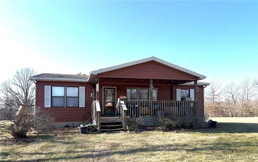 LOOKING FOR LAND?  WITHOUT RESTRICTIONS?  CHECK OUT THIS 38+ ACRES AT THE INTERSECTION OF T ROAD AND HWY 135, JUST SOUTH OF STOVER OR NORTH OF LAURIE, CLOSE TO THE LAKE OF THE OZARKS, ALSO, NEAR THE OZARK RACEWAY.  THIS 3 BEDROOM 2 BATH HOME SITS ON A FULL, UNFINISHED BASEMENT, THAT IS PLUMMED FOR ANOTHER BATHROOM AND PLENTY OF ROOM TO BUILD MORE BEDROOMS OR SPACE FOR FAMILY AND FRIENDS.  NEWER VINYL LAP SIDING, ARCHITECTURAL SHINGLES, COVERED FRONT DECK AND AN ADDITIONAL DECK ON THE BACK OF THE HOUSE.  VAULTED CEILINGS WITH STAINLESS REFRIGERATOR AND GAS RANGE.   A CUTE AND COZY HOME WITH ROOM TO GROW!  SELLERS REDUCED PRICE FOR QUICK SALE.  Contingent with Kick Out Clause