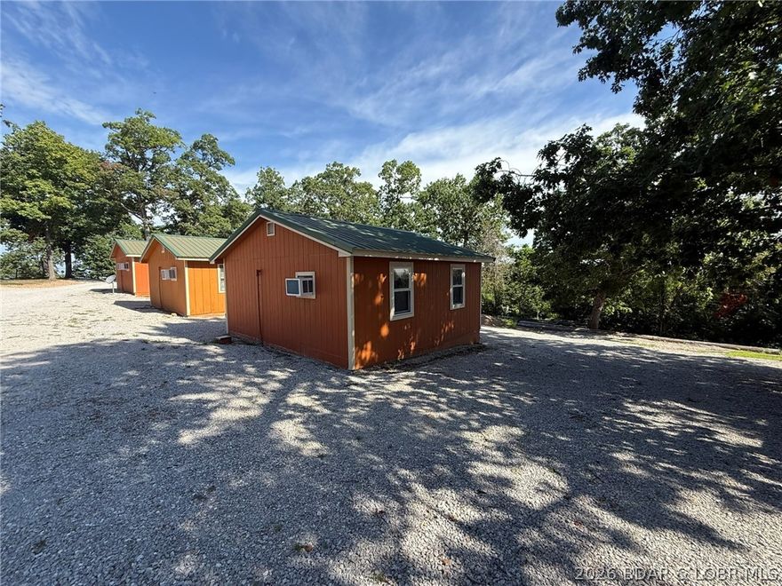 Cabin 1 & Cabin 2 are single-unit layouts, each with two full-size beds and a hide-a-bed, kitchenette with 4-burner cooktop, refrigerator, and toaster oven, plus full bath. Cabin 3 is a single-room unit with one king-size bed, kitchenette with 4-burner cooktop and refrigerator, toaster oven, and full bath. Just down the road from Truman State Park Marina giving you quick and easy access to Truman Lake, while also being close to Drake Harbor where you can access the Lake of the Ozarks. All three cabins have been successful rentals and have a long clients list. Would make for a great income producing opportunity.