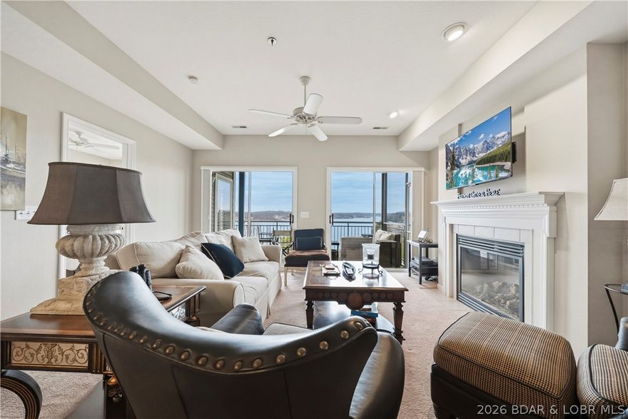 Amazing main channel views from this condo at Palisades! Welcome to your cozy lake getaway. This move-in ready, beautifully maintained 3 bedroom, 2 bathroom condo comes furnished and includes your own 30ft boat slip with a 10,000lb lift. You will love the open layout with a bright, modern feel, LVP flooring and gas fireplace. Master bedroom has walk in closet, double vanities, and sweet plantation shutters on the windows. Kitchen has nice bright white cabinets and stainless-steel appliances. Plus, HVAC and water heater are newer, so no worries there. Relax and take the views from your screened-in, covered deck, perfect for enjoying the lake year-round. Complex features 3 pools, clubhouse, and gated entrance. Ideally located on the 14MM where you are in a prime spot to experience everything the lake has to offer.  Perfect as a personal retreat or would make a great investment property!