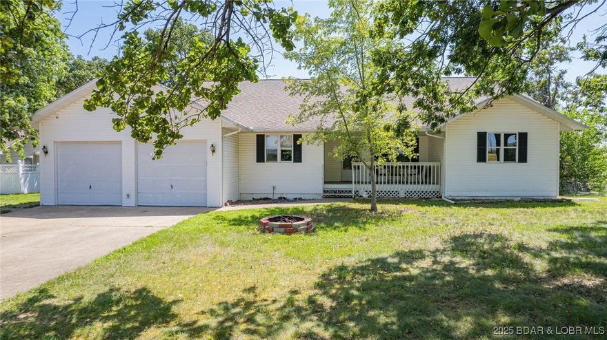 BACK ON THE MARKET AND AT NO FAULT OF THE SELLERS!  It’s all about location! This charming 3-bed, 2.5-bath home sits just off Hwy 5, right across from the Ozarks Amphitheater—yep, you can enjoy live music from your own front porch! You’re also just five minutes from Camdenton’s best spots for food, shopping, and fun. Inside, it’s all easy, one-level living with a bright, open layout, a spacious kitchen with stainless steel appliances, and a breakfast bar that’s perfect for morning coffee. The oversized 2-car garage gives you tons of extra storage, and the living space flows right out to a covered back porch and a fenced backyard—ideal for summer BBQs and hanging out with friends. Bonus: the HVAC and furnace were replaced in 2021, and water/sewer are handled by the HOA for added convenience. This place has the perfect mix of comfort, space, and location—don’t miss it!  Under contract w/ 72 hr kick-out.