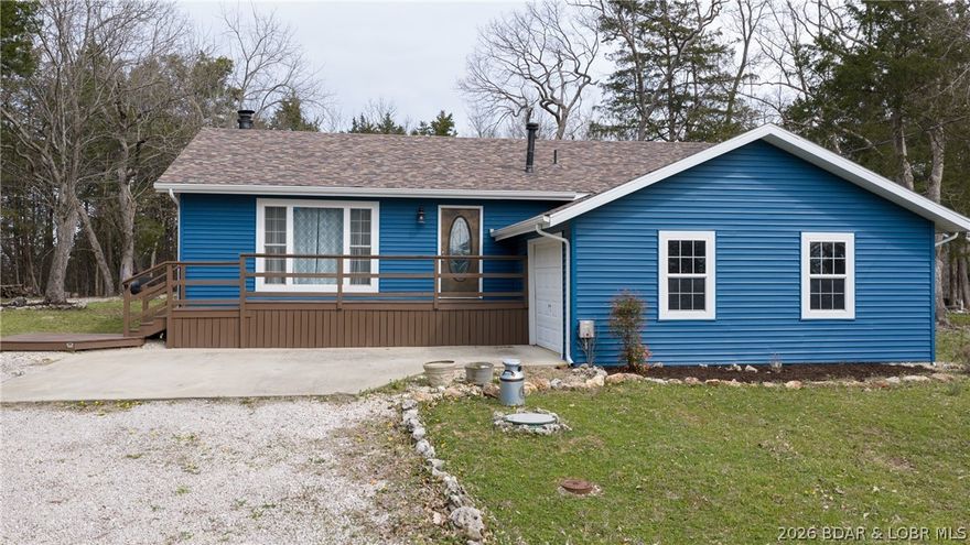 Fresh updates and easy one-level living come together in this well-maintained 3-bedroom, 2-bath ranch in Sunny Slope subdivision in Camdenton! Situated on over half an acre, this property offers a seasonal lake view, mature trees, a fire pit, and access to community boat ramps—perfect for enjoying Lake of the Ozarks. Conveniently located just down the road from Lake Valley Golf Course and Old Kinderhook Golf Course, and close to Camdenton schools, shopping, dining, and local attractions. Inside, you’ll find numerous recent improvements, including a new roof, siding, soffits, and gutters (2022), updated interior paint, crown molding, new carpet, modern light fixtures, LVP flooring, and refreshed bathrooms. The kitchen features stainless steel appliances (approx. 5 years old) and a reverse osmosis system. A natural stone wood-burning fireplace adds warmth and character, while the oversized 1-car garage and expansive flat yard provide ample parking, including space for a camper. Schedule your showing today!