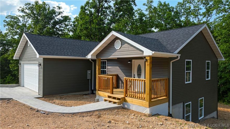 Brand new and beautifully crafted by Worthy Homes Construction, this stunning home features a bright, open-concept main level designed to maximize space and natural light. This home offers 3 bedrooms/2.5 baths and 1650 sq.ft.  The inviting living area flows effortlessly into an upgraded kitchen complete with granite countertops, stainless steel appliances, white shaker cabinetry, and a stylish tile backsplash. A spacious dining area and convenient main-level powder room add both comfort and functionality. 
Enjoy the convenience of a two-car garage and step through the sliding glass door onto a deck overlooking peaceful wooded views—perfect for relaxing or entertaining. The walk-out lower level offers three bedrooms, including a generous primary suite with a walk-in shower, along with a full second bath for family or guests. A second deck and private backyard extend the living space outdoors. Finished in a cohesive, modern color palette with quality materials throughout, this move-in-ready home also includes a completed paved driveway and walkway. Schedule your showing today and make this beautiful new home yours.