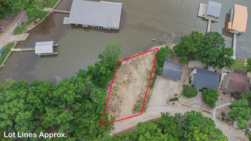 Perfect location right by the four corners on the 29 mm in a deep water cove this exceptional waterfront lot is FLAT and a perfect spot to build your dream home! This prime location offers a HUGE dock envelope (see attached drawings) with the ability to install a 2 well dock with dual PWC spots and a large swim platform. Nestled in a sought-after area, you'll enjoy both privacy and convenience off F Rd - just minutes by car or boat to hotspots like Papa Chubby's, Paradise, Frankie and Louie's and Lake House 13! Don't miss out on this unique opportunity to own a slice of paradise at an affordable price! *SEE ATTACHED FOR APPROVED SEPTIC PLAN AND DOCK DRAWINGS* This one is priced to sell quick, so don't miss out! See additional listing offering lot with spec home.